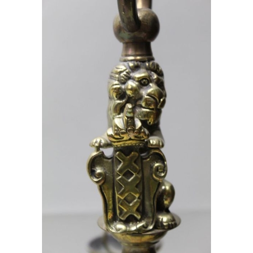 136 - A 19th century Dutch brass six branch candelabra, the lion mount supporting the shield of Amsterdam ... 