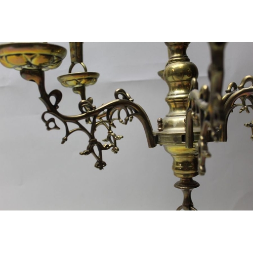 136 - A 19th century Dutch brass six branch candelabra, the lion mount supporting the shield of Amsterdam ... 