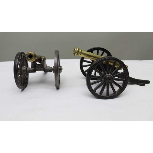 137 - A pair of late Victorian brass and cast iron models of canons, the wheels 8cm in diameter