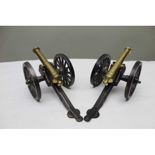 137 - A pair of late Victorian brass and cast iron models of canons, the wheels 8cm in diameter