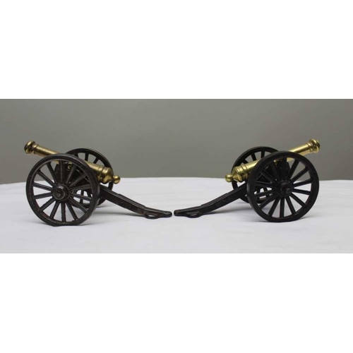 137 - A pair of late Victorian brass and cast iron models of canons, the wheels 8cm in diameter