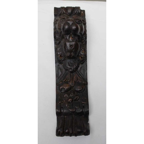 145 - A small carved oak lion mask, 10cm, together a pair of carved oak lion mounts, 31cm