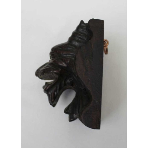 145 - A small carved oak lion mask, 10cm, together a pair of carved oak lion mounts, 31cm