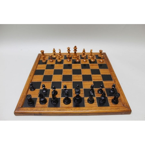 149 - A 20th century turned wood Staunton pattern chess set with board