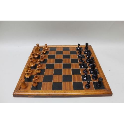 149 - A 20th century turned wood Staunton pattern chess set with board