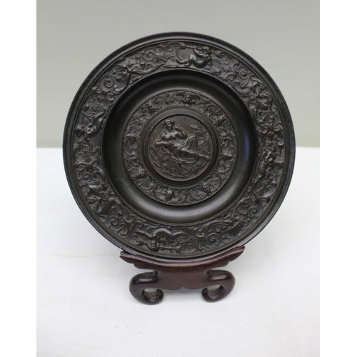 154 - A 19th century cast bronze roundel, Classical figure to centre with lyre, surrounded by a border wit... 