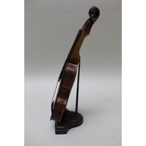 156 - A painted tin plate model violin, 31cm, on ebonised stand