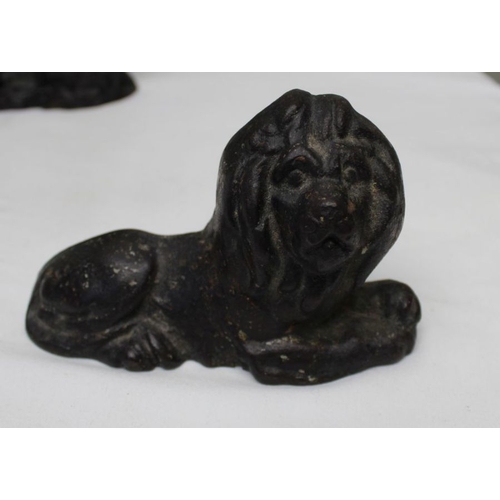 162 - A 19th century cast iron lion, 9cm high, together with a carved wood spread eagle, and a brass fox d... 