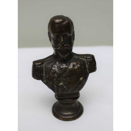 165 - A late 19th century cast bronze bust of a King, 10.5cm, together with a model of the Westminster Cor... 