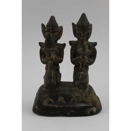 172 - A 19th century cast bronze of two kneeling devotional figures, holding forth offerings, possibly Nep... 