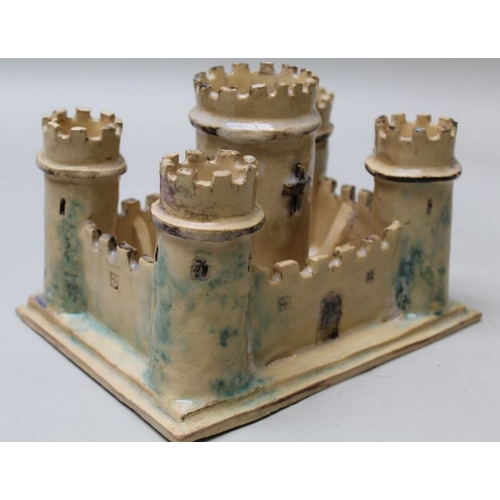 201 - A 20th century studio pottery castle, with turrets and battlements, the base 19cm x 25cm