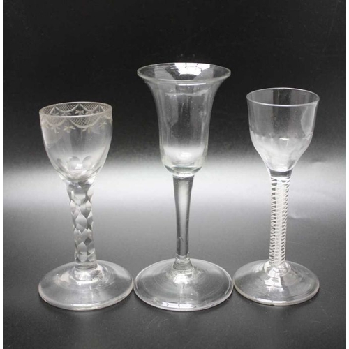 212 - An 18th century plain stem glass, circa 1750 folded foot, partially polished, an 18th century engrav... 