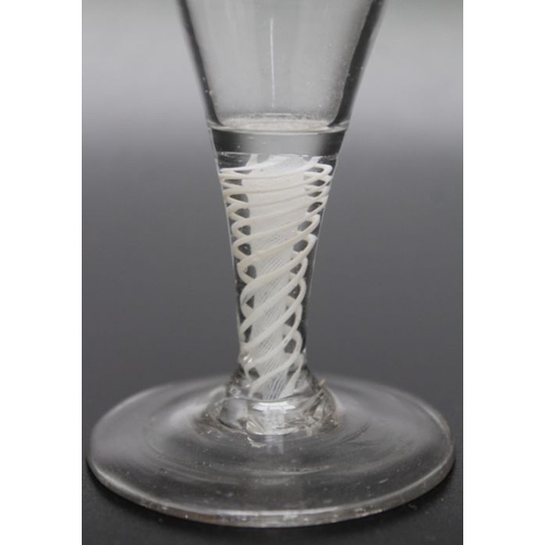 213 - An 18th century opaque twist cordial glass, two piece construction circa 1770, An 18th century bubbl... 