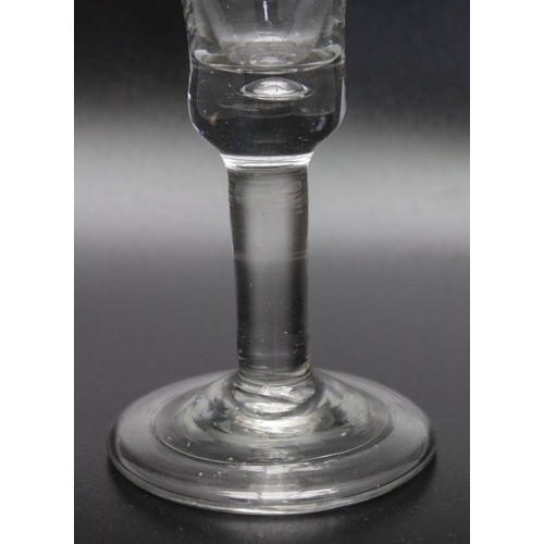 227 - An early 18th century heavy baluster glass with folded foot circa 1730