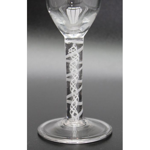 231 - A 18th century opaque twist glass with folded foot circa 1760, together with an 18th century plain s... 