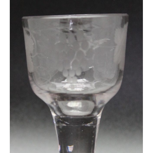 239 - An 18th century engraved plain stem glass 