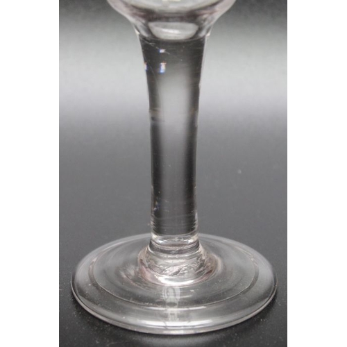 239 - An 18th century engraved plain stem glass 