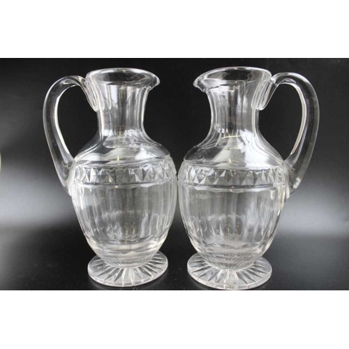 255 - A set of four early 19th century Georgian design facet cut jugs, with applied handles and star cut b... 