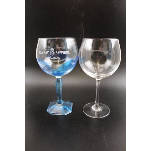 260 - Two gin glasses together with a plain blown glass vase 25cm tall