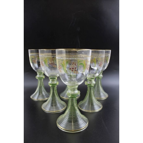 263 - A set of eleven German Hock glasses, gilded fruiting vine decoration, on pale green out swept stems,... 