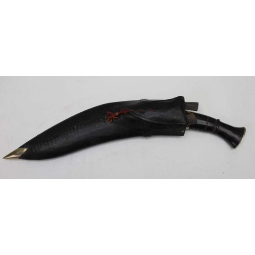 272 - A plain traditional kukri knife with matching pair in a black leather holster