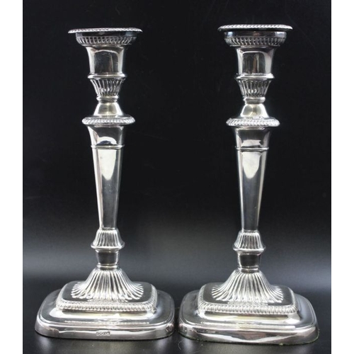 31 - A pair of Victorian silver plated candlesticks, Adam design with gadroon borders, and removable drip... 