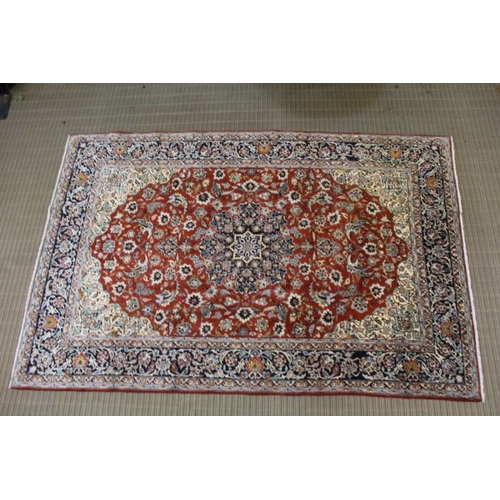 365 - A woven woollen floral Najaf Abad carpet, 310cm x 201cm