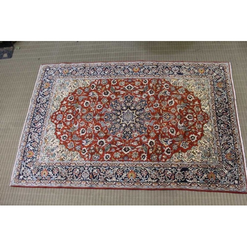 365 - A woven woollen floral Najaf Abad carpet, 310cm x 201cm