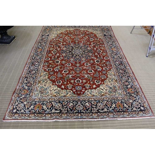 365 - A woven woollen floral Najaf Abad carpet, 310cm x 201cm