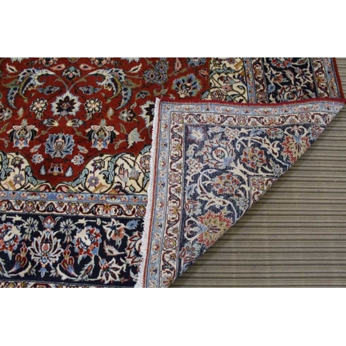 365 - A woven woollen floral Najaf Abad carpet, 310cm x 201cm