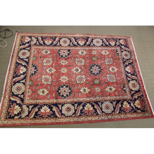 367 - A woven woolen floral Sarough carpet with deep guard borders, 315cm x 233cm