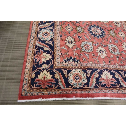 367 - A woven woolen floral Sarough carpet with deep guard borders, 315cm x 233cm