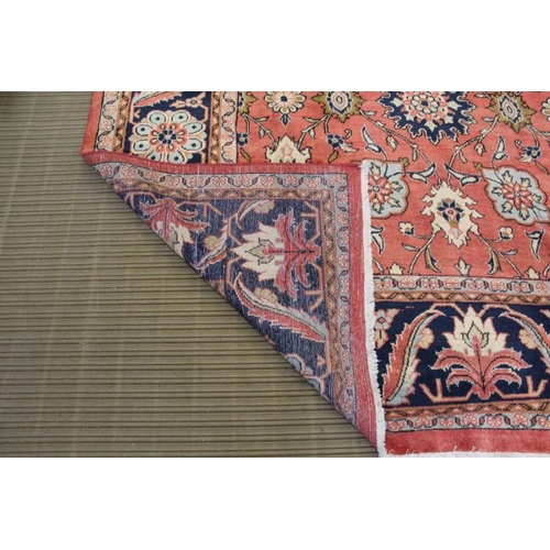 367 - A woven woolen floral Sarough carpet with deep guard borders, 315cm x 233cm