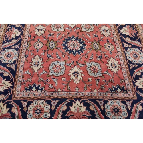 367 - A woven woolen floral Sarough carpet with deep guard borders, 315cm x 233cm