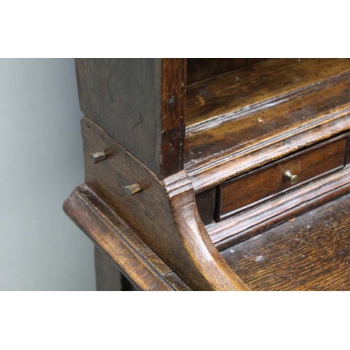 375 - A George III oak dresser, with plate rack back, a run of small drawers above the base fitted three d... 