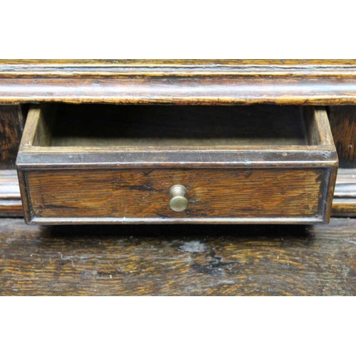 375 - A George III oak dresser, with plate rack back, a run of small drawers above the base fitted three d... 