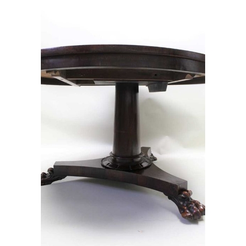 380 - A 19th century rosewood breakfast table, plain column tri-corn plinth with three paw feet, 72cm high... 