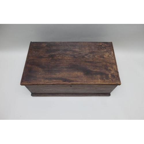 381 - A 19th century elm coffer, the hinged lid revealing a candle box, 82cm wide