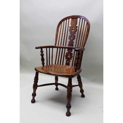 385 - A 19th century provincial hoop stick & pierced splat back, open armchair, yew wood with an elm seat,... 