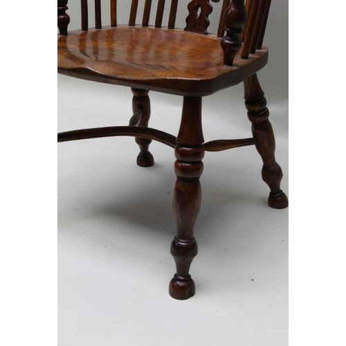 385 - A 19th century provincial hoop stick & pierced splat back, open armchair, yew wood with an elm seat,... 