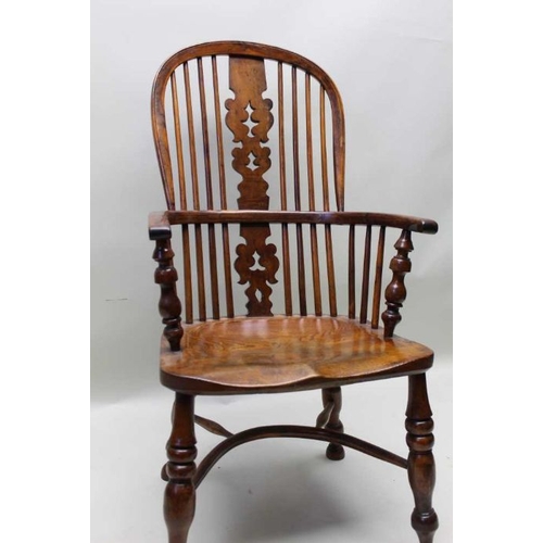 385 - A 19th century provincial hoop stick & pierced splat back, open armchair, yew wood with an elm seat,... 