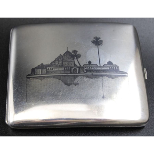 39 - An Iraqi  Niello white metal cigarette case, decorated with river scenes to either side, 8cm x 9cm, ... 