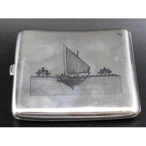 39 - An Iraqi  Niello white metal cigarette case, decorated with river scenes to either side, 8cm x 9cm, ... 