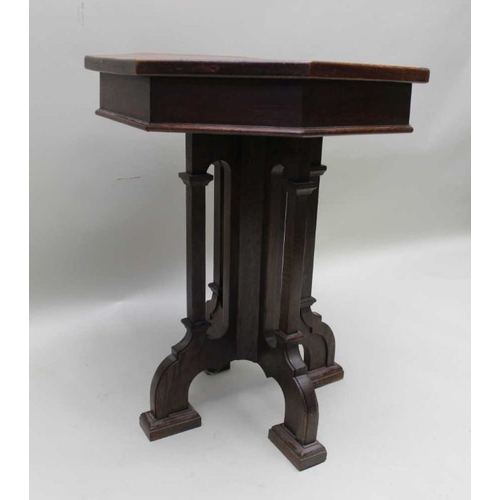 394 - A 19th century oak lamp table of Gothic design, octagonal top, on cluster supports and four arched f... 