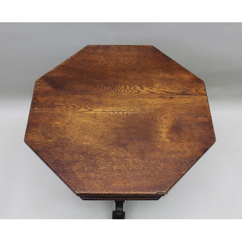 394 - A 19th century oak lamp table of Gothic design, octagonal top, on cluster supports and four arched f... 