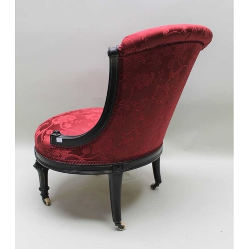 396 - A late Victorian ebonised framed salon chair, patterned crimson fabric upholstery, 80cm high