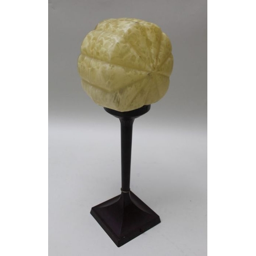 404 - An Art Deco lamp, bakelite base, mottled shell glass shade, 47cm high