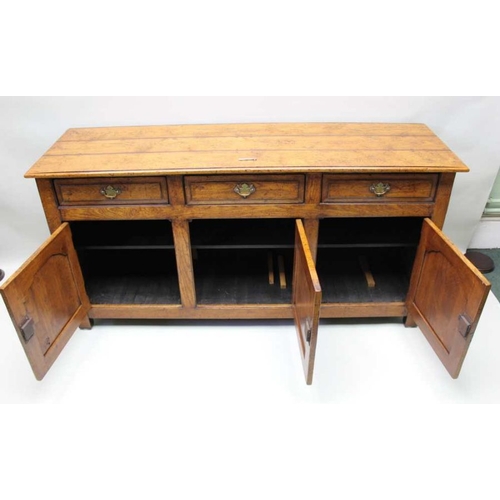 416 - A well made reproduction oak dresser, planked top over three inline drawers & three cupboard doors, ... 