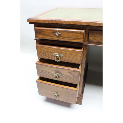 420 - A late Victorian oak twin pedestal desk with inset skiver top over three inline drawers upon two thr... 