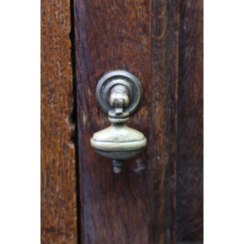 422 - A late 18th century Estate cupboard later adapted two piece oak, the upper section with panelled doo... 